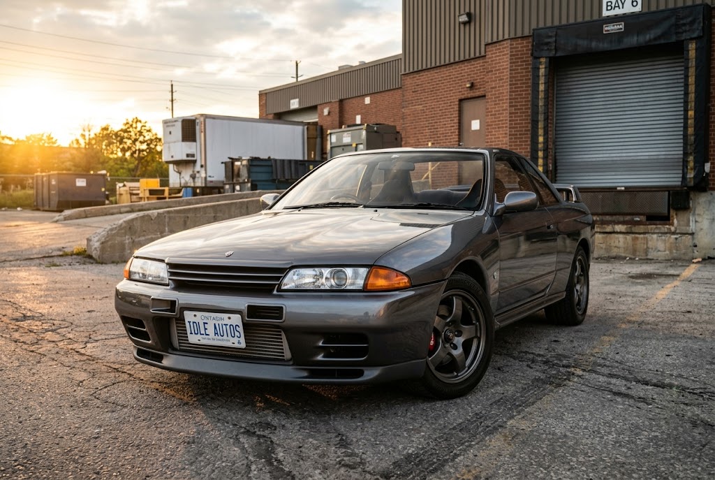 1990 Nissan Skyline GT-R R32 in gun metallic at industrial loading dock